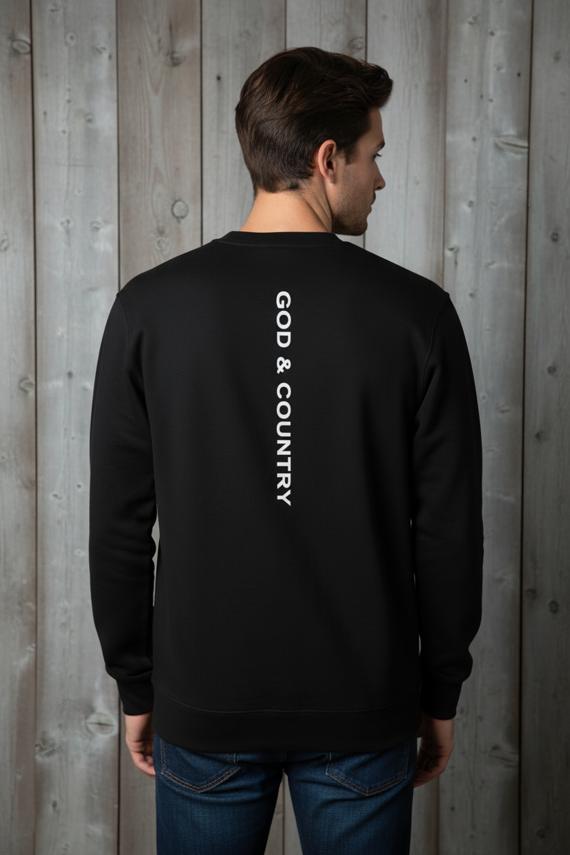 Same male model from behind wearing black crewneck with white GOD & COUNTRY text